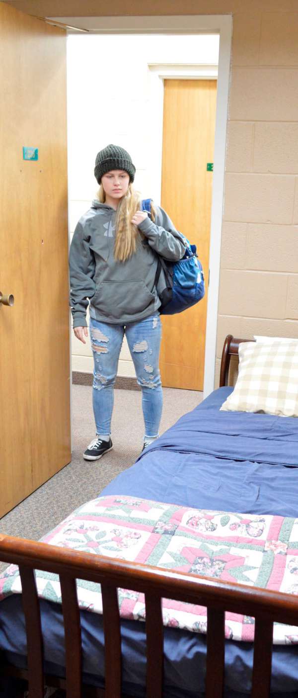 Girl walking into room at Safe Haven